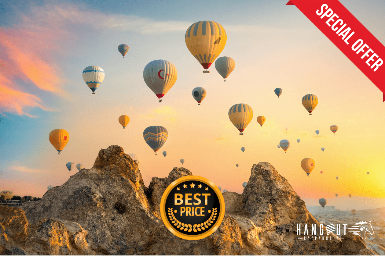 Hot air balloons floating over Cappadocia's unique landscape at sunrise